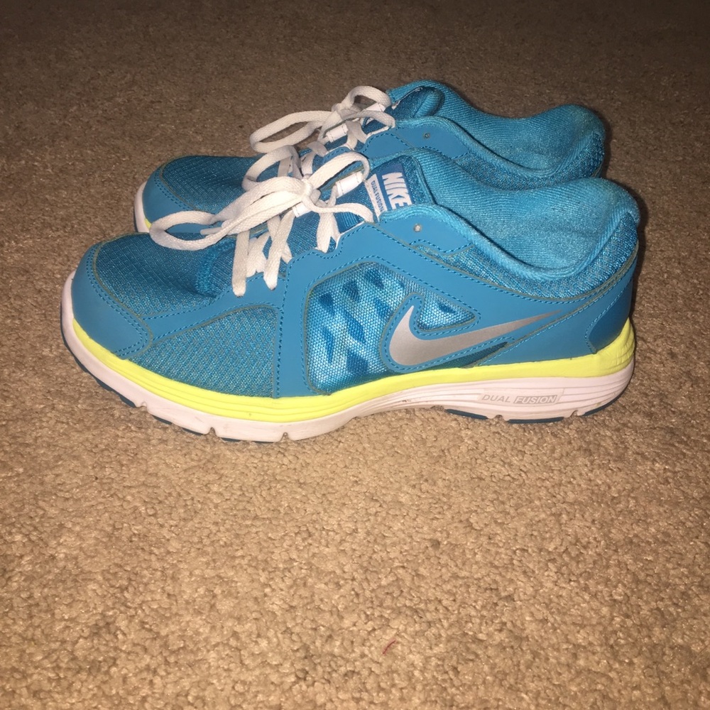 Blue teal and neons yellow Nike shoes