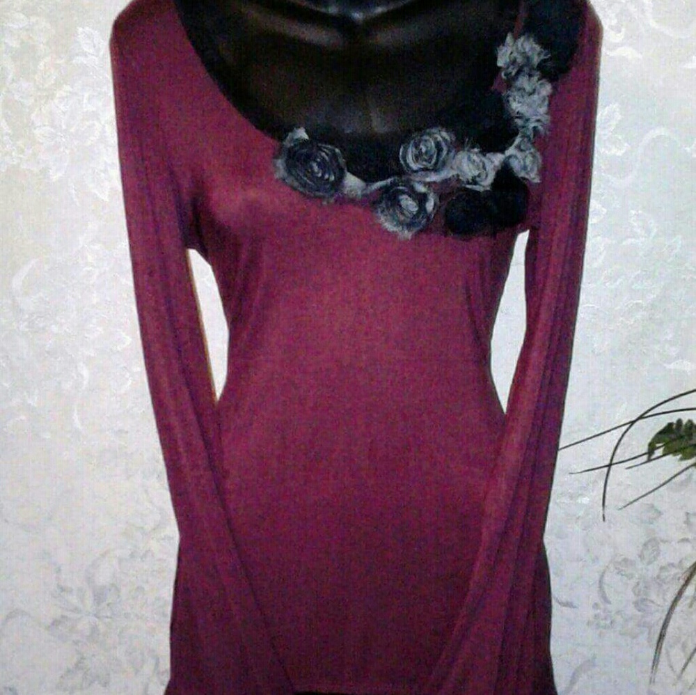 A long sleeve dress shirt with flowers on collar,