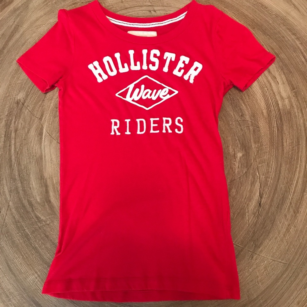 A Red Hollister Shirt With White Writing.