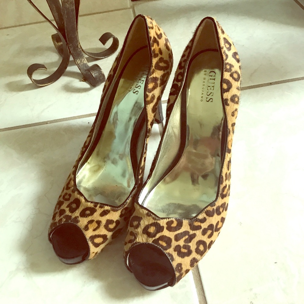 Leopard print open toe high heels.