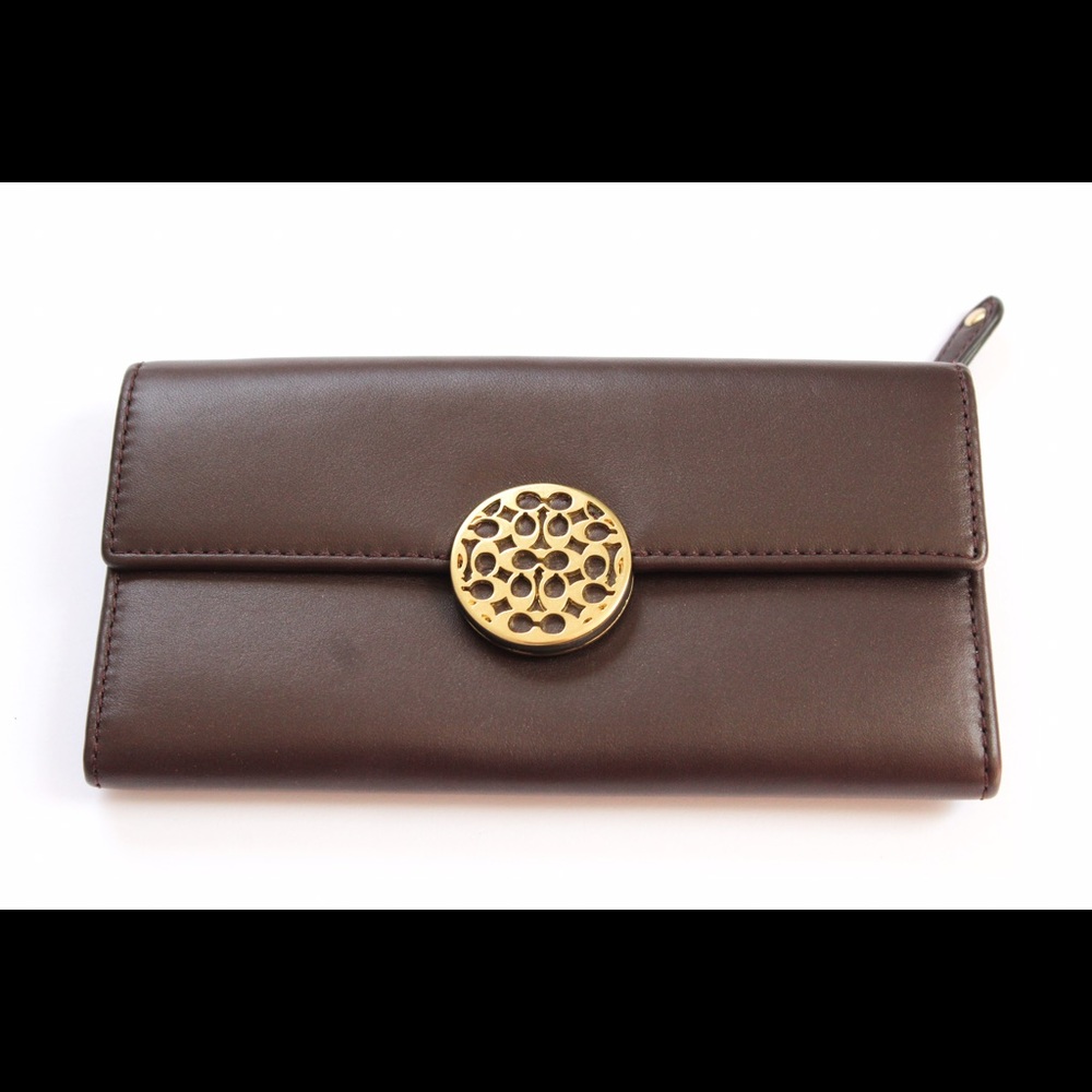 Coach tri-fold wallet with gold emblem