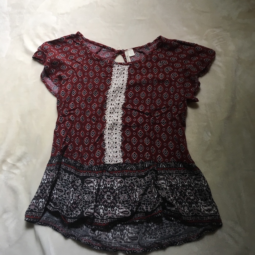 Red and patterned peplum styled shirt