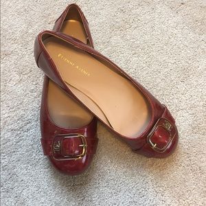 Red patten leather flats.