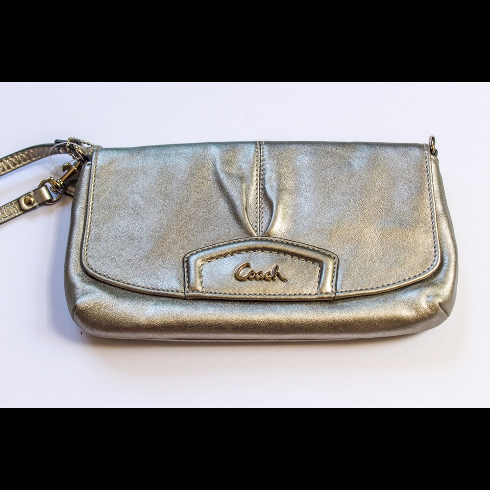 Never used Coach large flap wristlet.