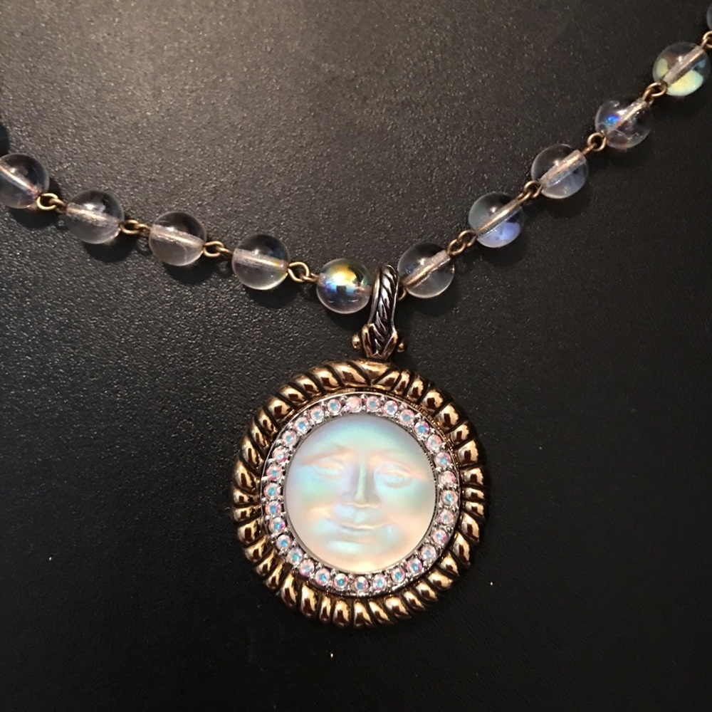 Real mother of pearl moon face necklace.