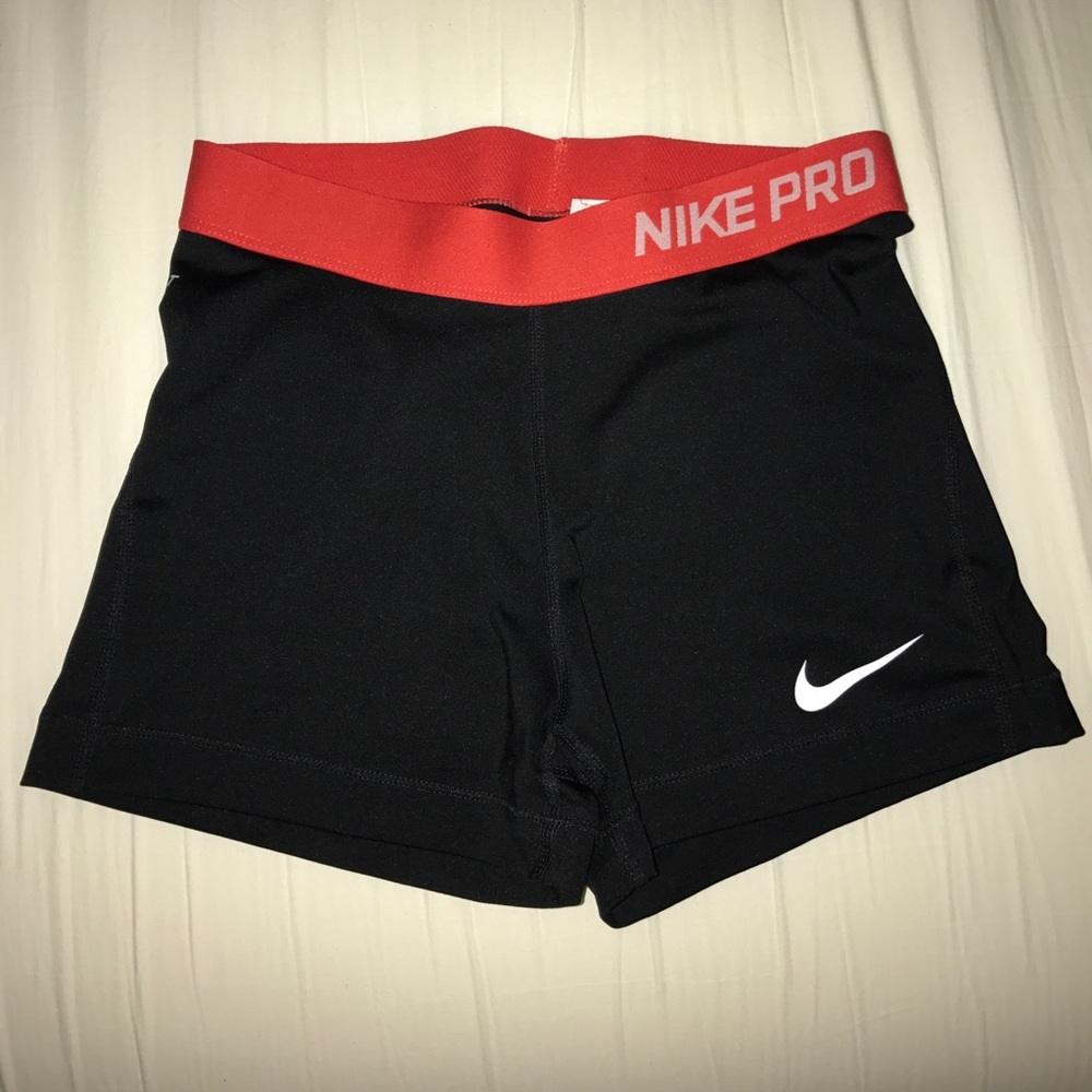 Black nike pros with red waist band