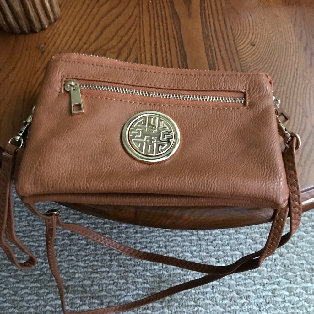 Tan new cross body or wristlet