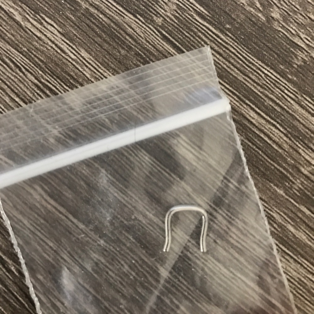 Metal septum retainer
