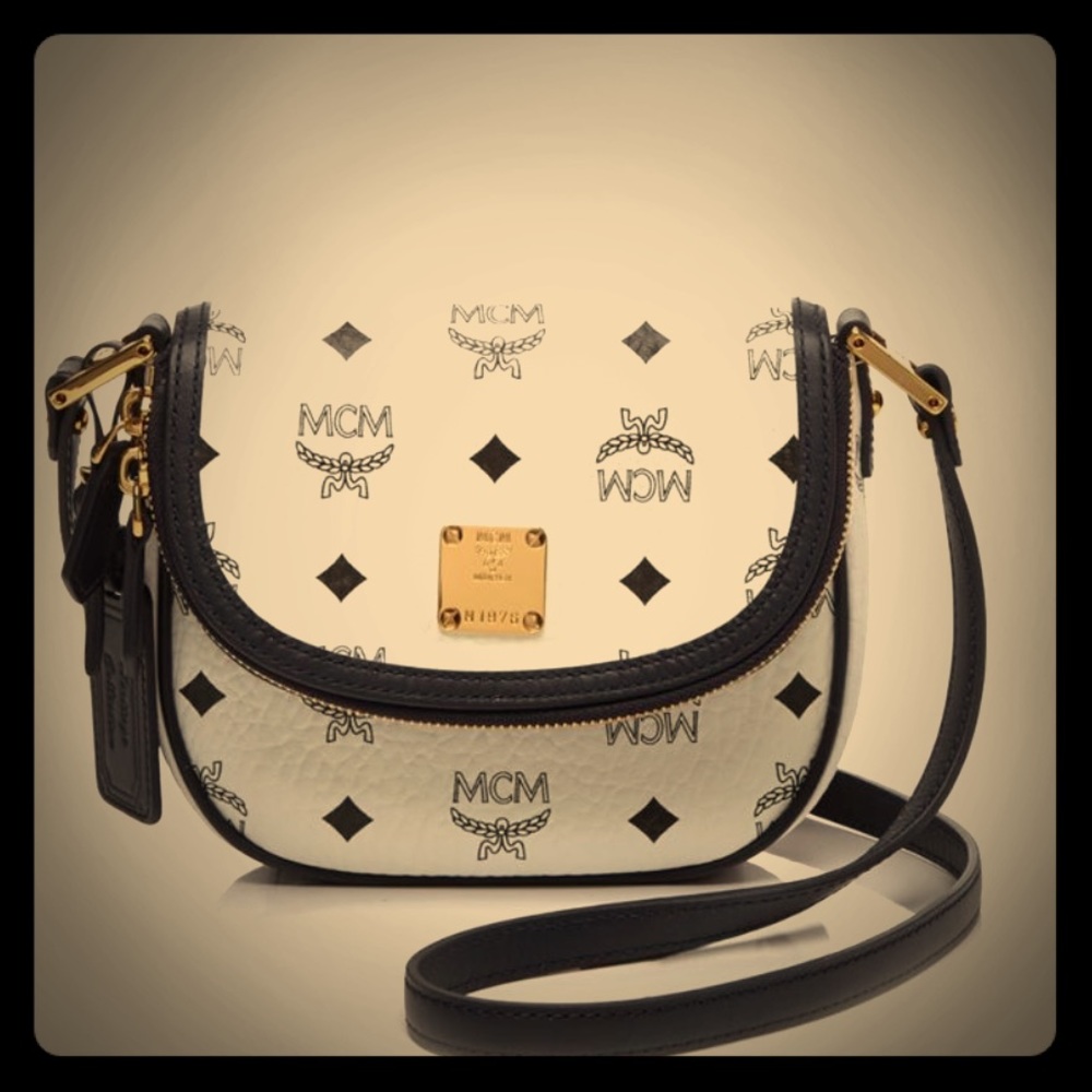 MCM cross body white with navy trim.