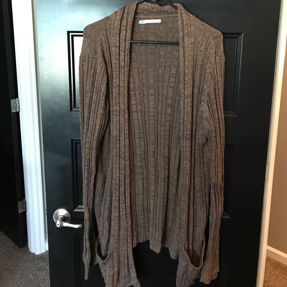Maurice's long brown sweater