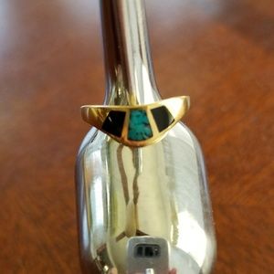 C 89  *  size 7. *  gold tone over metal ring