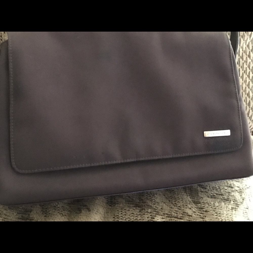 A brown Capezio handbag; adjustable shoulder strap