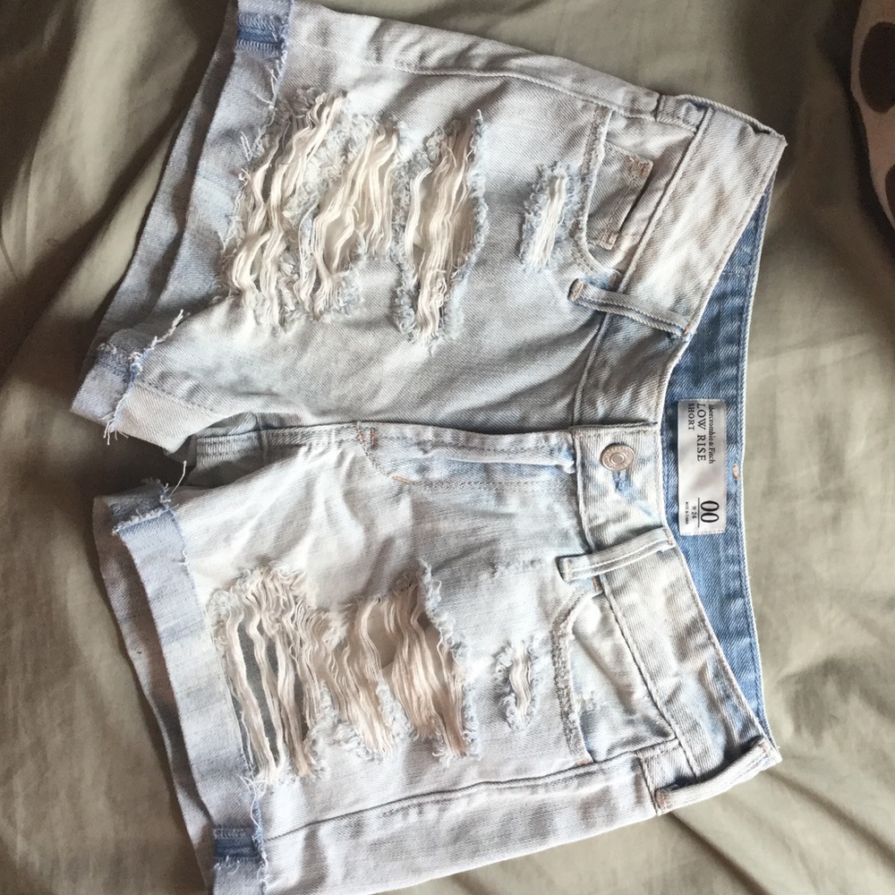 light wash ripped jean midi shorts