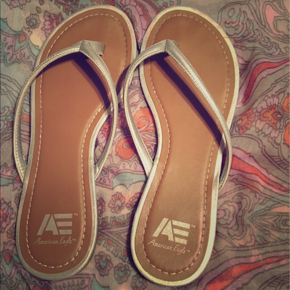 American Eagle silver flip flops