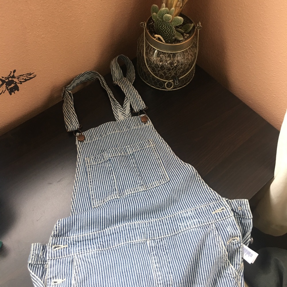 Distressed stripe overalls.