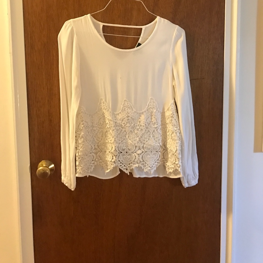 Cute white blouse with cut out back