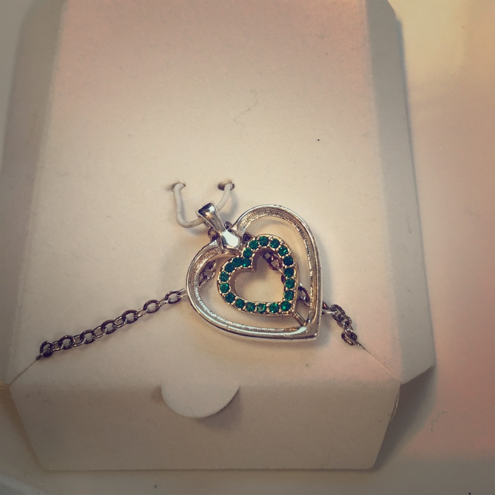 Silver/gold emerald stones reversible necklace.
