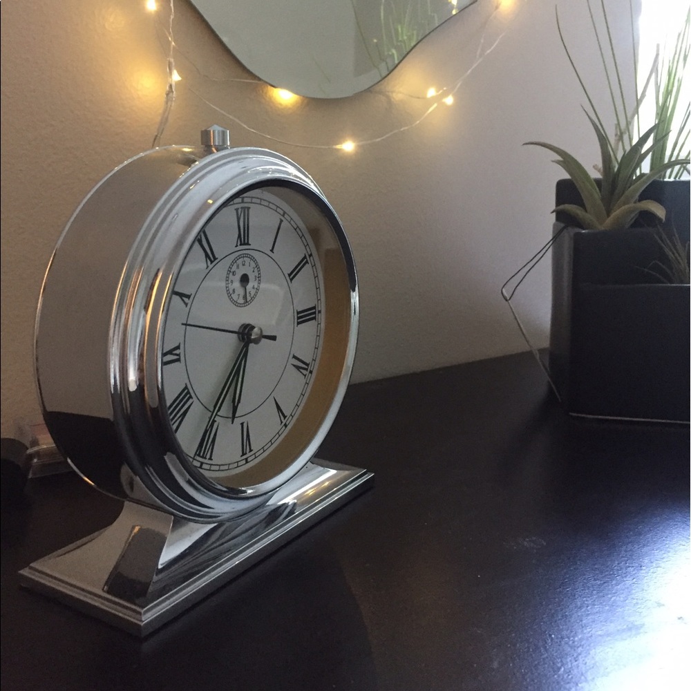 Silver analog alarm clock