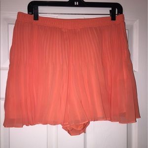 Salmon colored pleated skort