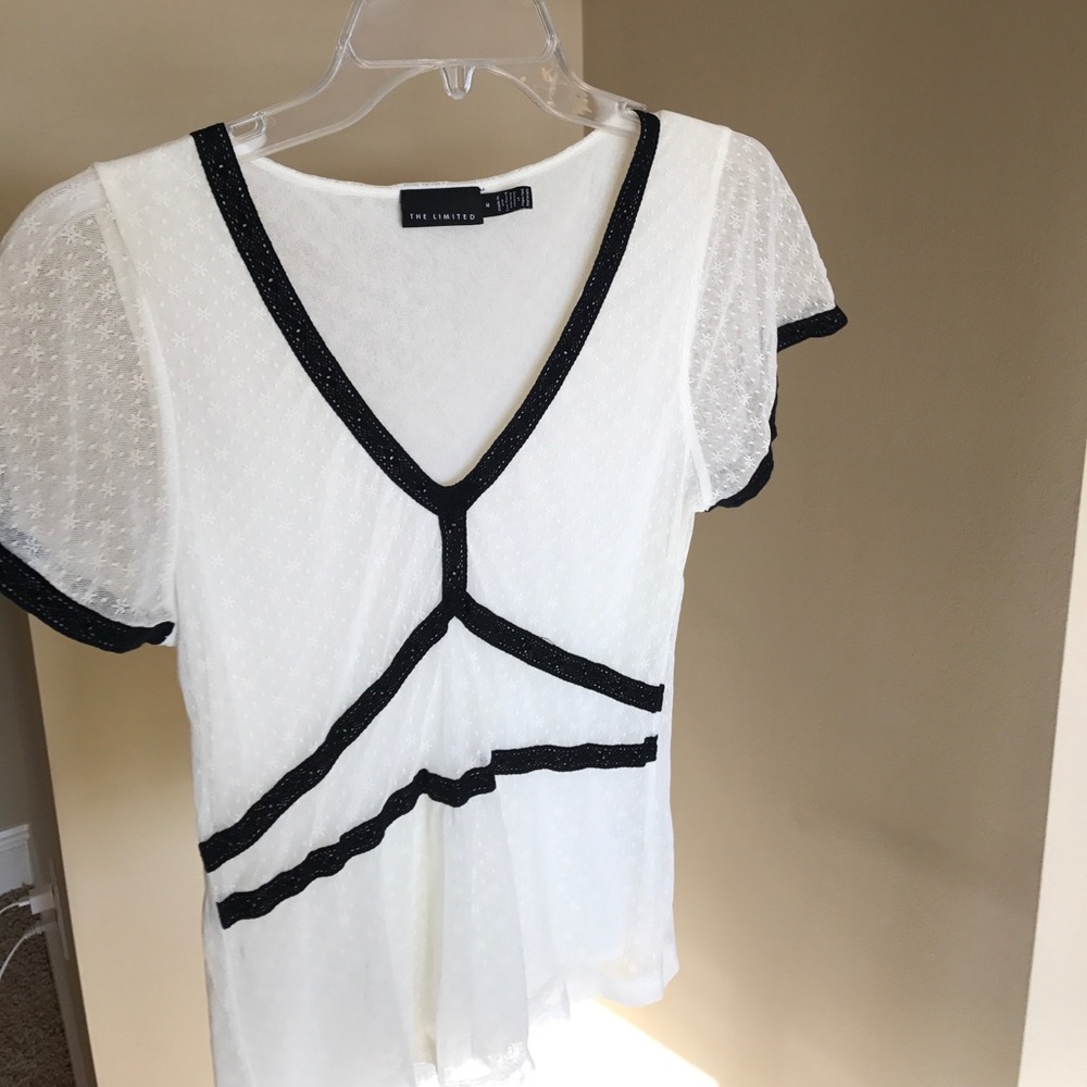 Cream and black lace top.