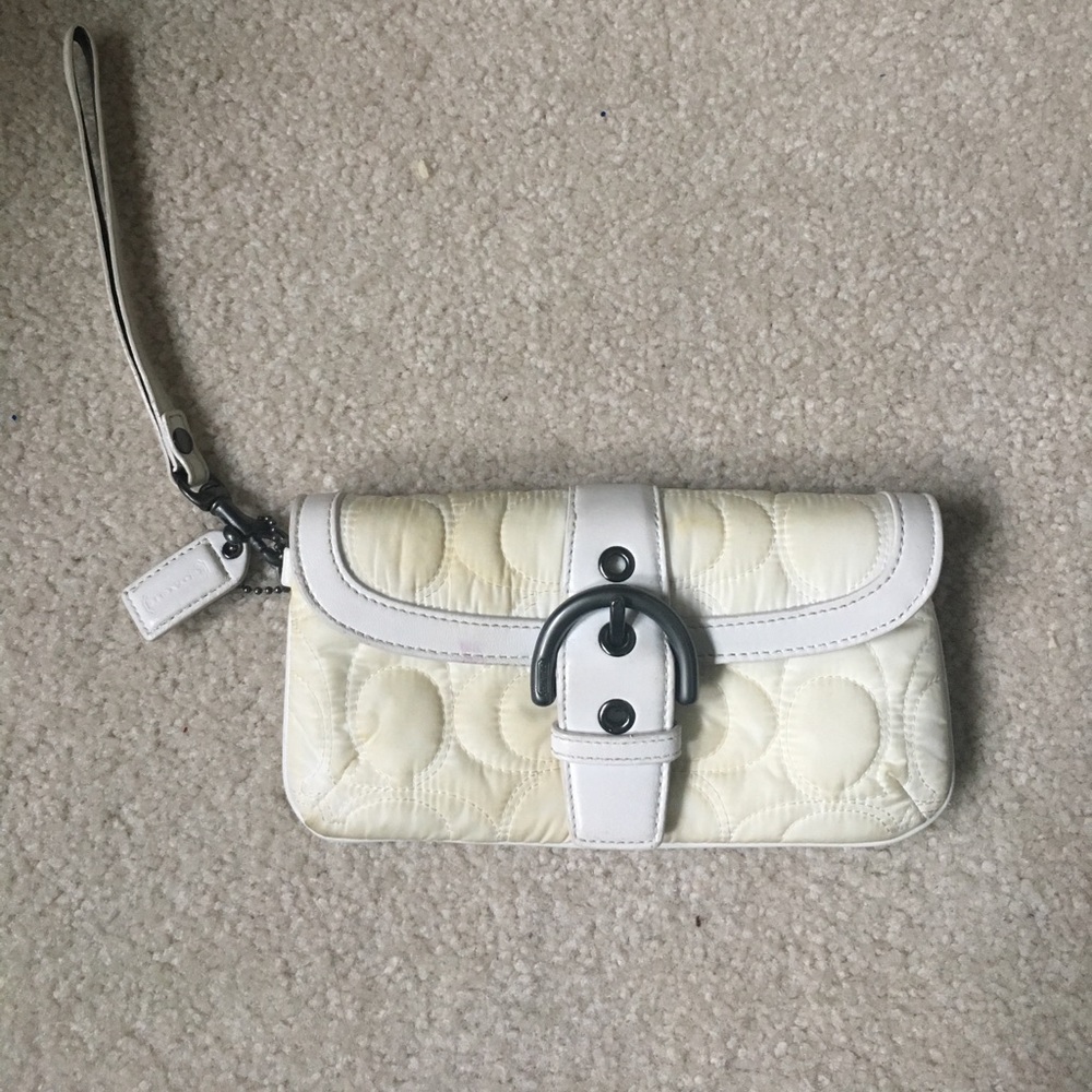 Cream coach wristlet.