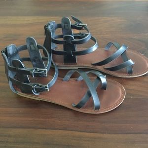 Black leather gladiator sandals