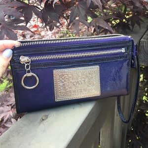 Coach Poppy patent leather deep purple wristlet