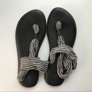 Sanuk gray and white straps
