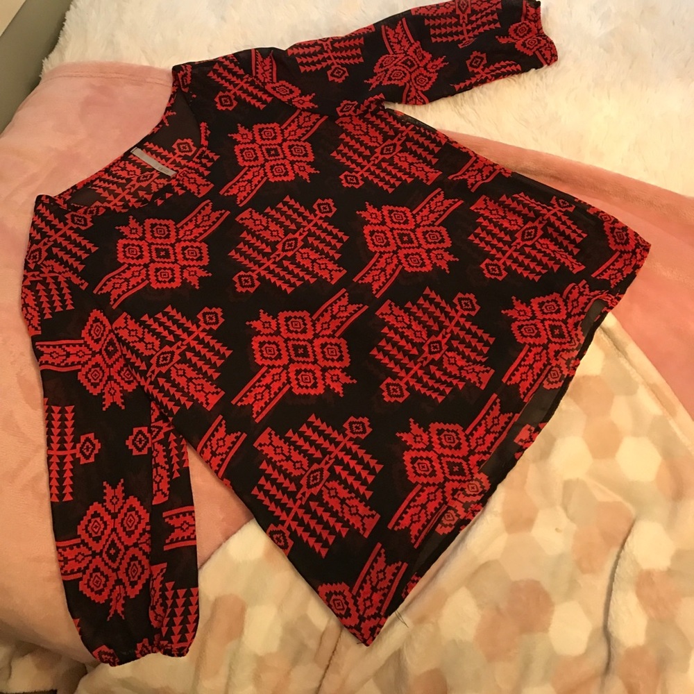 red and black patterned blouse