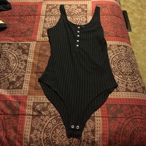 Black ribbed body-suit.