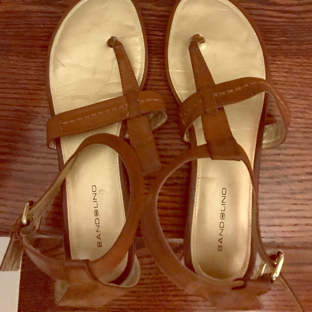 Used sandals missing loop on one