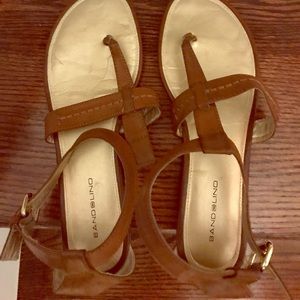 Used sandals missing loop on one