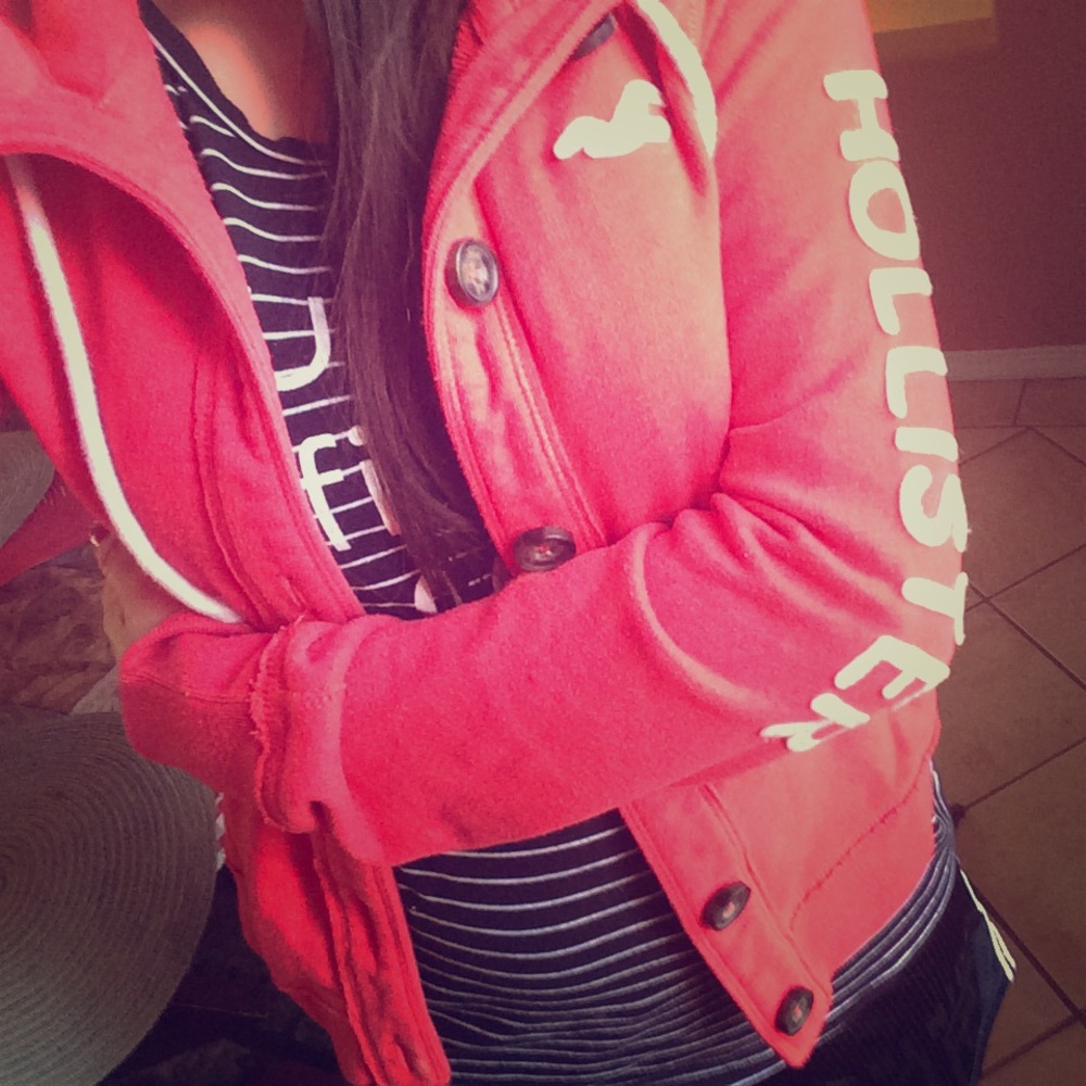 I am selling a coral sweater.