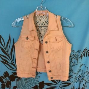 Light salmon colored denim vest with lace back