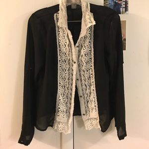 Sheer black button down with white floral trimming