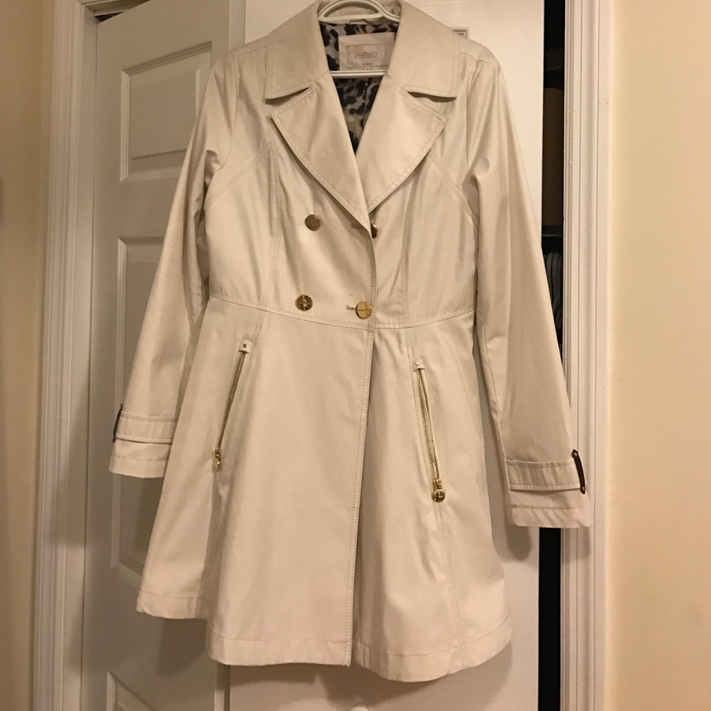 Double-breasted flared trench coat.