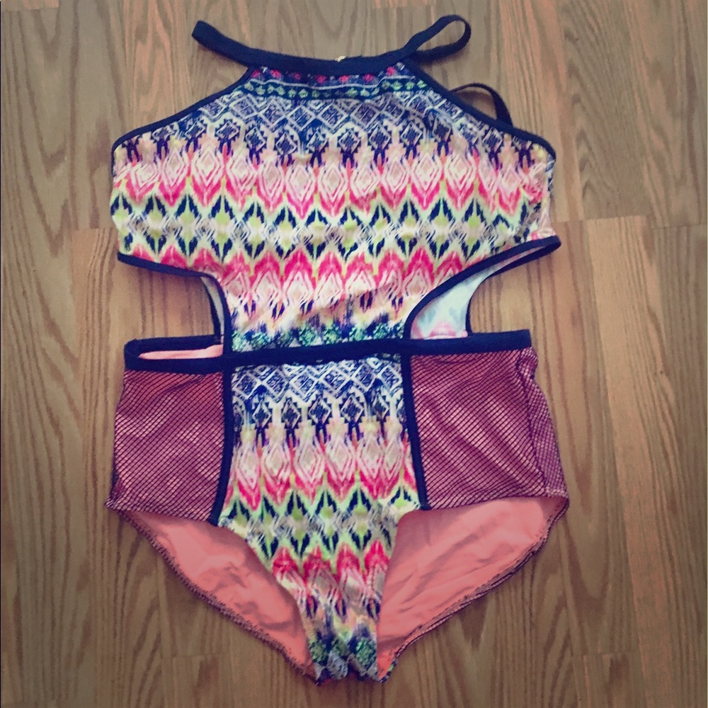 One piece swimsuit with cutouts.
