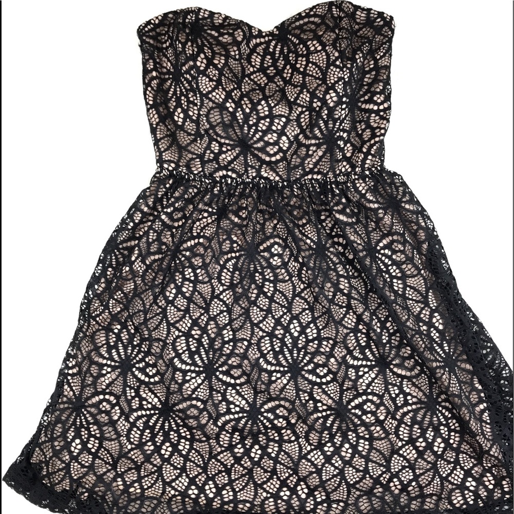 Black and nude cutout dress with bow back