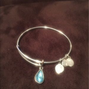 Silver Alex & Ani bracelet with blue stone