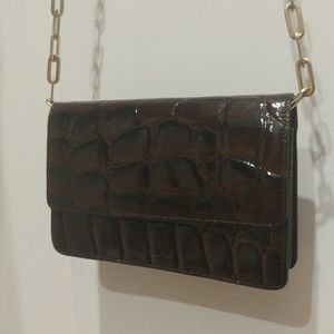 Burgundy leather clutch handbag