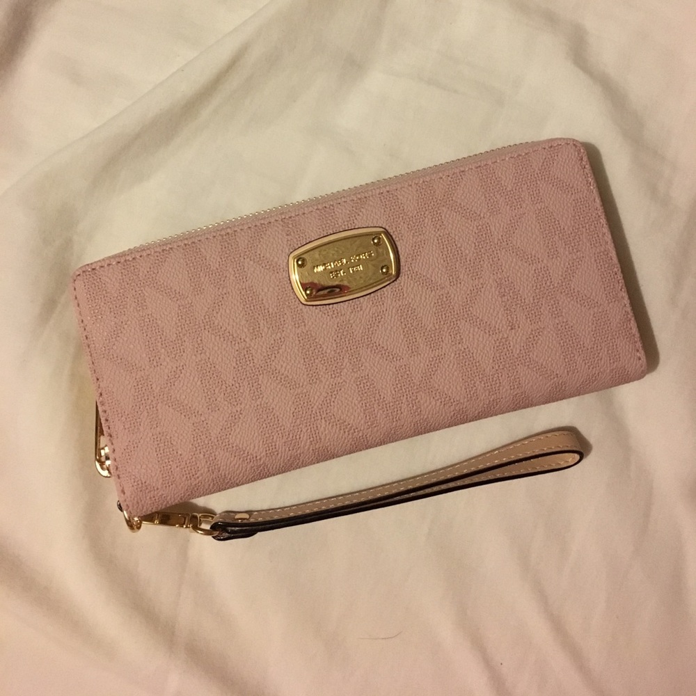 Authentic large baby pink Michael Kors wallet.