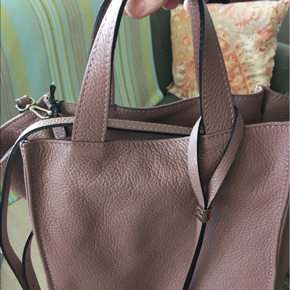 Nwt lightweight leather tote bag with long strap.