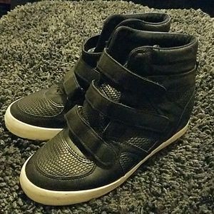 Black sneaker boots.