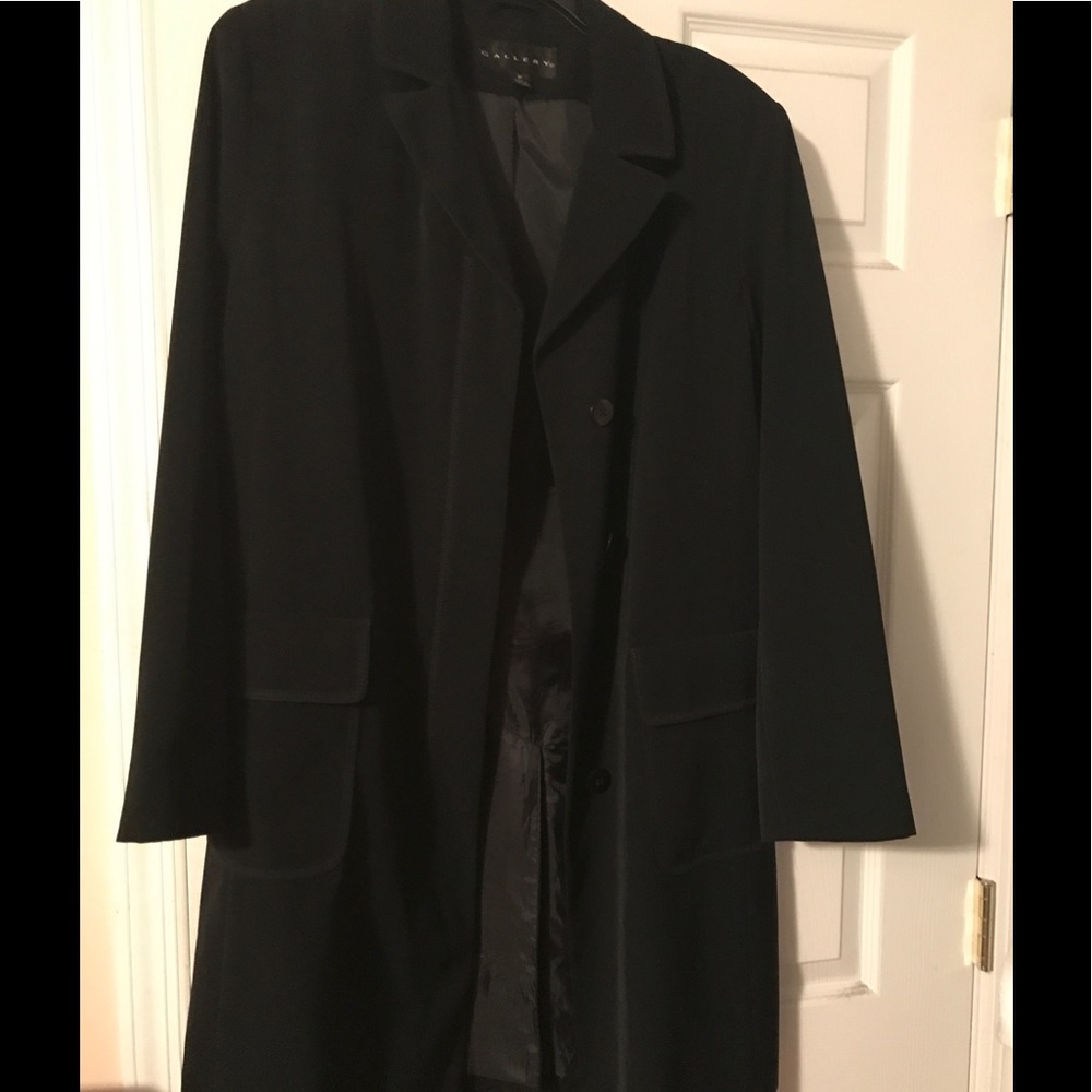 Black jacket with piped stitching detail.