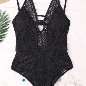 Brand new black one piece bathing suit.