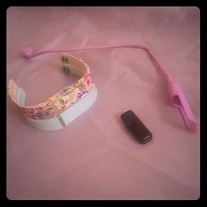 Fitbit Flex with two small bands and charger.