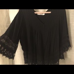 Black shirt with embroidered lace pattern