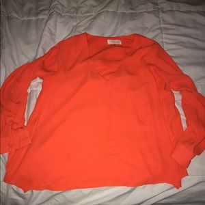 Bright orange blouse