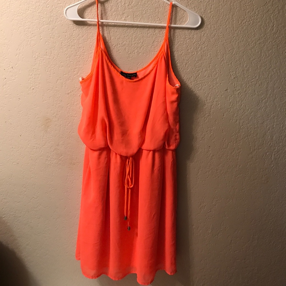 Bright orange summer dress.
