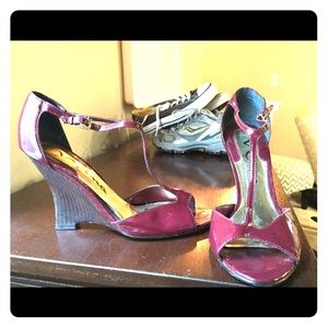 Wine color, patent leather wedge sandal.